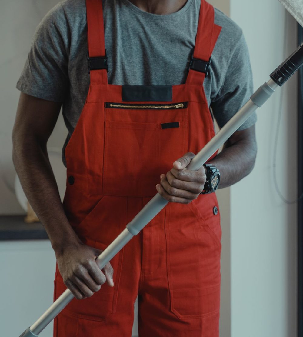 Cleaner squeegeeing large office windows