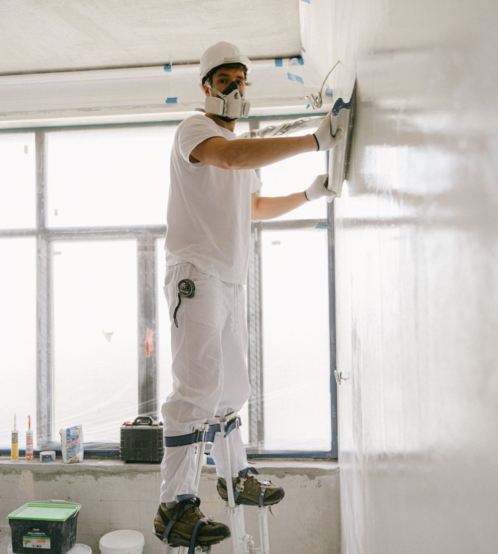 Contractor finishing a home renovation before final cleaning