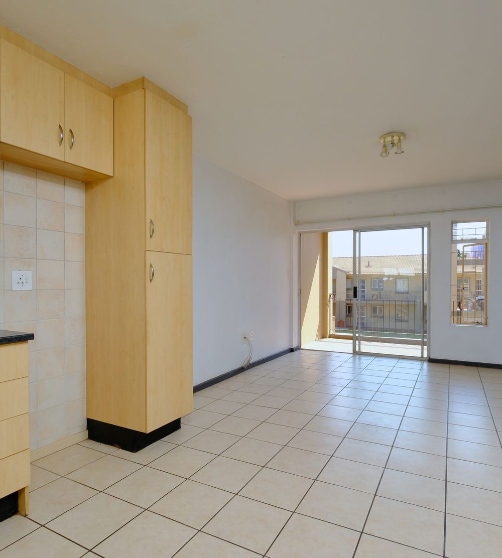 Empty apartment kitchen ready for move-in cleaning