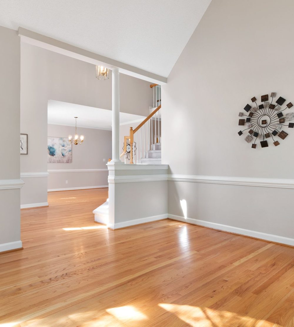 Empty house with hardwood floors after a move-out cleaning